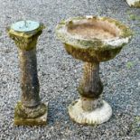 A reconstituted stone pedestal urn, height 70cm diameter 50cm together with a reconstituted stone