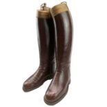 A pair of brown leather riding boots and trees, height of boots 40cm.The boot size is