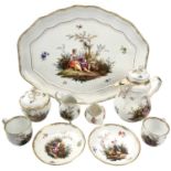 A Meissen cabaret set, 19th century, comprising; a shaped oval tray, a coffee pot and cover, a sugar
