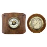 A brass marine aneroid barometer, the silvered dial stamped F.Smith & Son, Southampton, on an oak