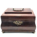 A George III mahogany and crossbanded brass mounted bombe shaped tea caddy, lacking original