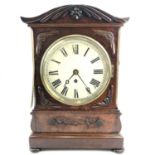 A William IV mahogany bracket clock, with swept top and applied brass decoration and mouldings,