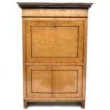 A Biedermeier burr maple secretaire chest, with a veined grey marble top above a frieze drawer,
