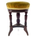 A Victorian walnut revolving piano stool, height 49cm, diameter 32cm.