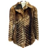 A Candian wolf fur coat size 38.