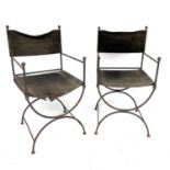 A pair of wrought Iron 'Bishop's' chairs, mid 20th century, with suede leather backs and slung