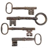 An 18th century iron key, with integral folding ring, length 15cm, together with three other iron