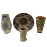 Three Charlotte Rhead vases, with tube-lined floral decoration and an Arabesque bowl, diameter 29.