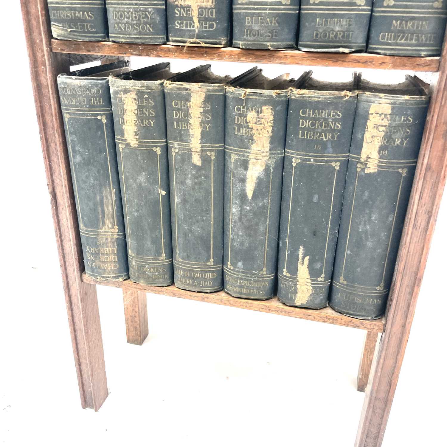 An oak narrow bookcase, early 20th century, containing 18 volumes of the Charles Dickens library, - Image 8 of 8