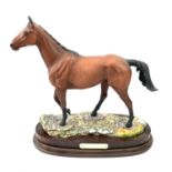 Royal Doulton, a figure of Arkle, modelled by Graham Tongue, number 160/5000, height 32cm, with wood