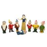 A painted lead Snow White figure, height 6cm, and the seven Dwarves.