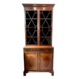 A late Victorian mahogany cabinet bookcase, in the Georgian taste, with a glazed upper part and a
