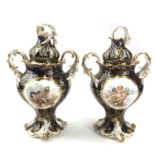 Pair of English porcelain pot pourri vases and covers, circa 1830, with blue and gilt cell borders