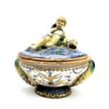 A late 19th century Cantagalli maiolica bowl and cover with eros on a dolphin and twin shell