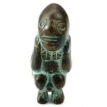 Pre-Columbian bronze fertility figure modelled as a naked squatting male with his hands under his