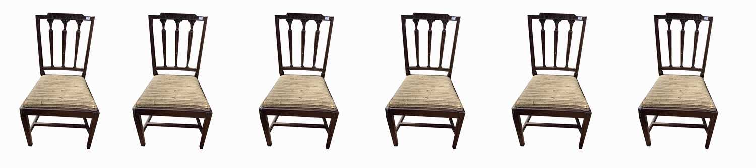 A set of eight George III mahogany dining chairs, including two carvers, with a triple vertical