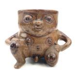 Alan Brough, A studio pottery mug or vessel, modelled as a rotund naked male in a kneeling pose,