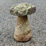 Granite circular staddle stone with tapering base, overall height 65cm diameter 44cm