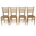 A Set of four beech ladderback dining chairs, in the style of Gio Ponti, with seagrass seats and