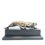 An Art Deco bronze model of a prowling panther, with remnants of plated finish, on an ebonised base,