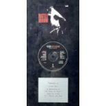 A framed presentation CD by U2.