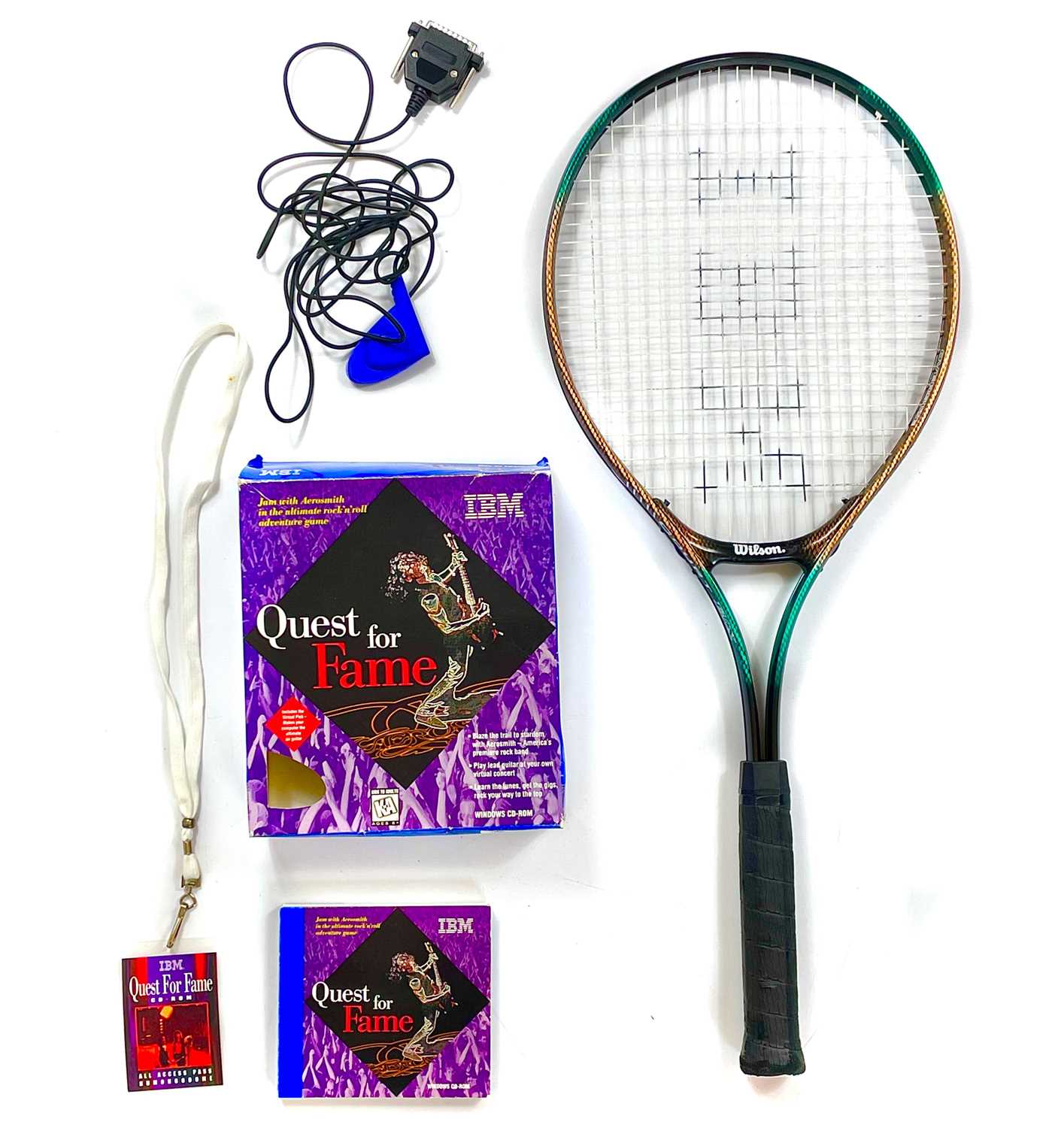 An Aerosmith Quest For Fame video game and tennis racket.