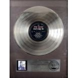 A RIAA platinum disc awarded to 'Billy Squier'.