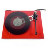 A stylish red Rega RP6 turntable.