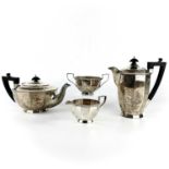 A George V silver four piece teaset by Walker & Hall.