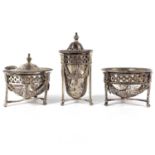 A George V silver neo-classical style three piece cruet set by S Blanckensee & Son Ltd.