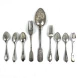 A collection of Russian silver spoons and forks.