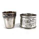 A French silver small cup and an Edwardian silver napkin ring.
