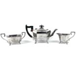 A George V silver Art Deco octagonal section three piece tea set by Viners Ltd.