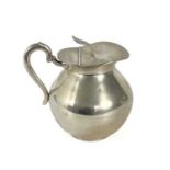 A mid 20th century Columbian 0.900 silver ovoid hinge lidded jug.