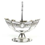 An Edwardian silver swing handled pedestal basket by Walker & Hall.