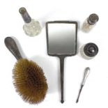 A collection of hallmarked silver dressing table items.