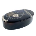 A Georgian tortoiseshell silver inlaid oval snuff box.