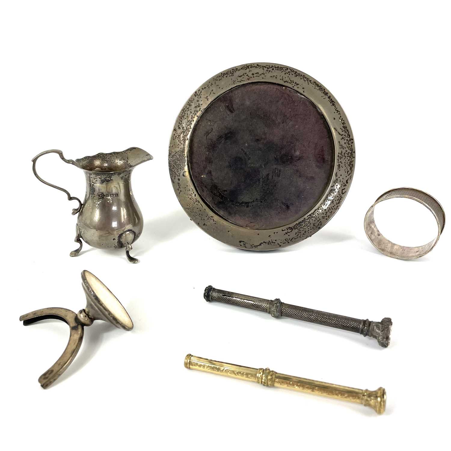 A selection of silver items including a 19th century propelling pencil.
