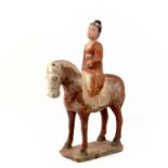 A Chinese terracotta pottery equestrian figure, Tang Dynasty. (618-907)