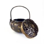 A Chinese bronze hand warmer / portable incense burner, 19th century or earlier.