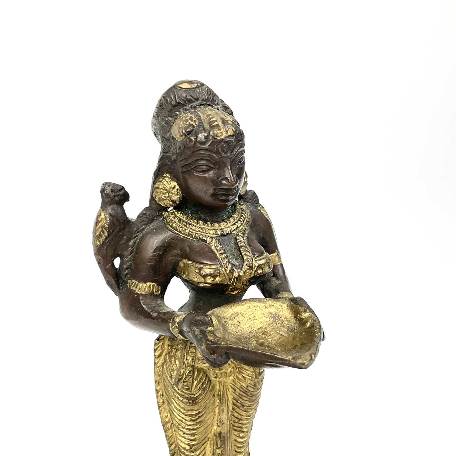 An Indian gilt bronze figural oil lamp. - Image 4 of 9