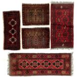 Two Afghan rugs.