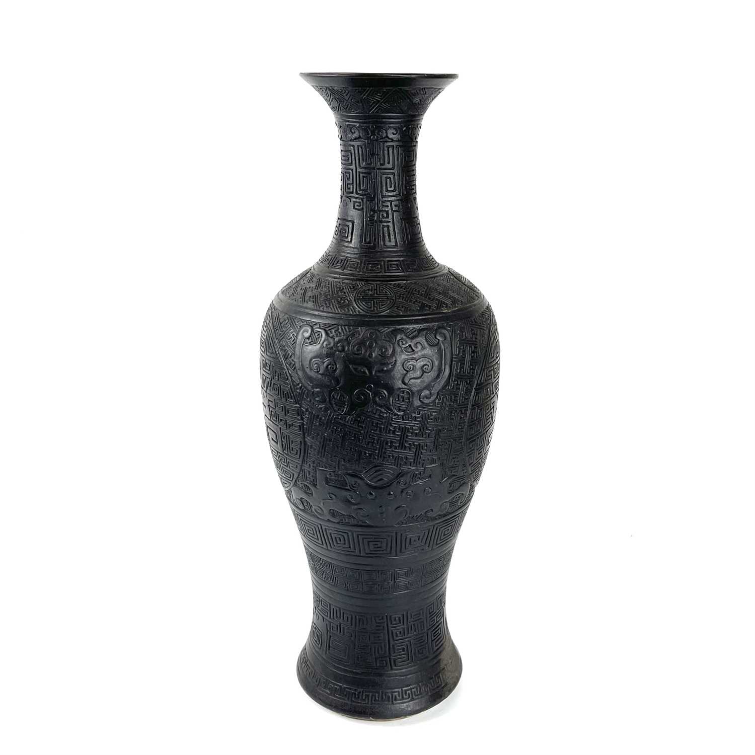 A large rare Chinese carved black porcelain vase, Qing Dynasty.