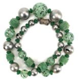 A Chinese green glass necklace.