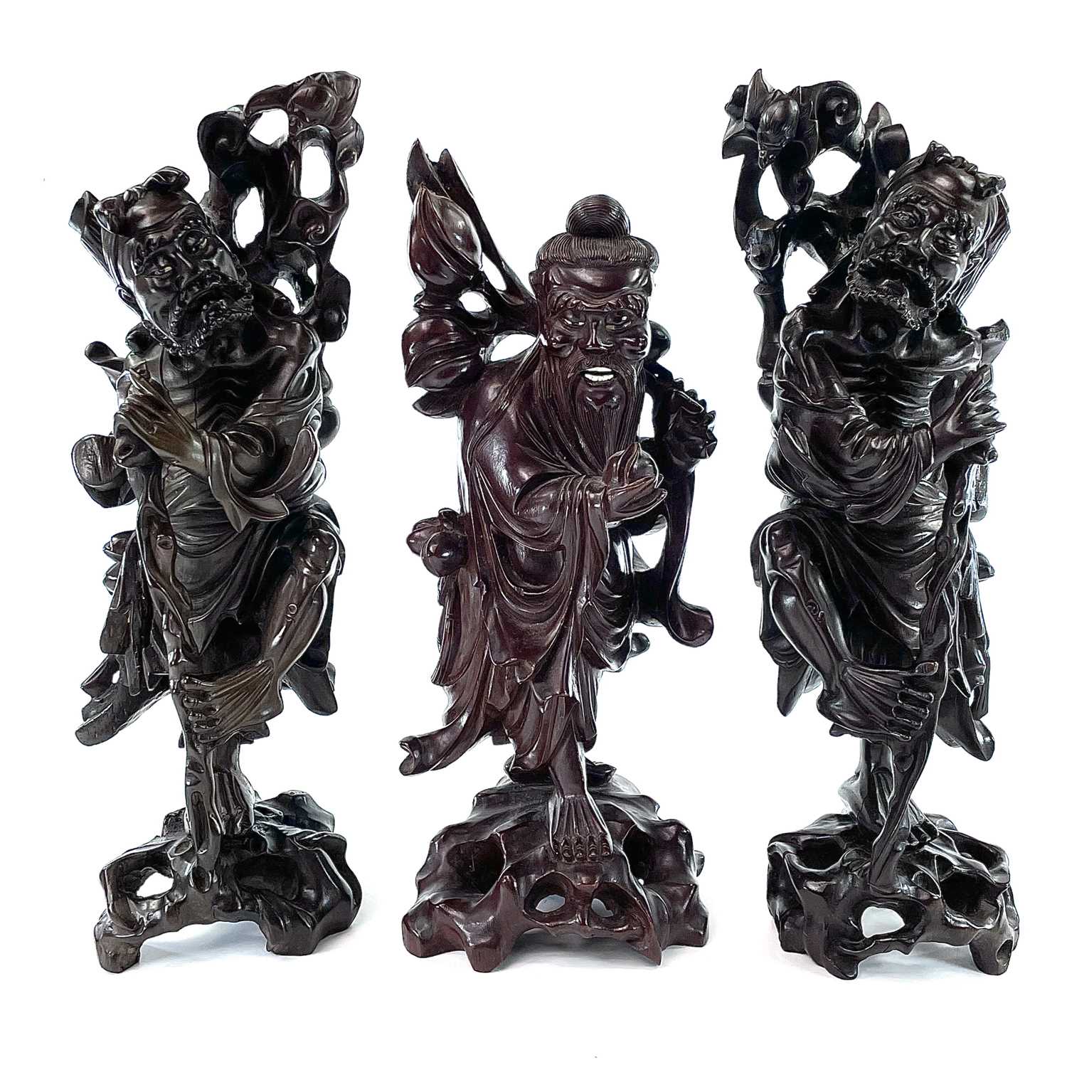 A pair of Chinese carved hardwood figures, late 19th century.