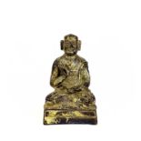 A Chinese gilt bronze figure of a seated buddha, 18th/19th century.