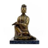 A Chinese bronze figure of a seated Guanyin, 20th century.