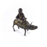 A Chinese bronze incense burner modelled as a sage sitting on a buffalo, 19th century.
