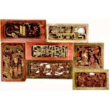 Seven Chinese carved wood gilt and red painted panels, early 20th century.