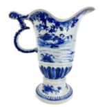 A 18th century Chinese porcelain blue and white export helmet jug.